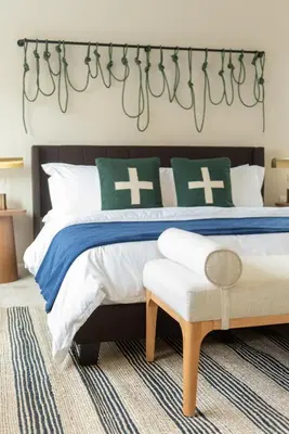 a bedroom with a large bed with green and white pillows at Colorado Haven: 5bd - Pool & Foosball - 10min UCB in Superior