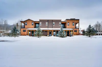 a large house in the snow in a field at 2 Mi to RMNP Mtn-View Grand Lake Loft! in Grand Lake