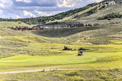 a golf course in the middle of a mountain at Ski-InandSki-Out Granby Ranch Condo with Pool Access in Granby