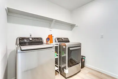 a kitchen with a stove and a dishwasher at 16 Mi to Denver Spacious Commerce City Home! in Commerce City