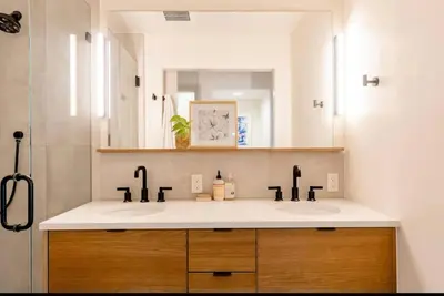 a bathroom with two sinks and a mirror at Unique Denver Designer Home 4 Bed 4 Bath in Denver