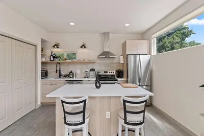 a kitchen with a white counter top and a refrigerator at Unique Denver Designer Home 4 Bed 4 Bath in Denver