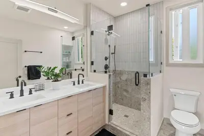 a bathroom with a shower and a toilet and a sink at Unique Denver Designer Home 4 Bed 4 Bath in Denver