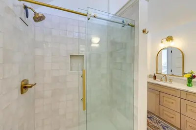 a bathroom with a shower with a glass door at Spacious Black Hawk Home with Deck and Mountain Views! in Black Hawk
