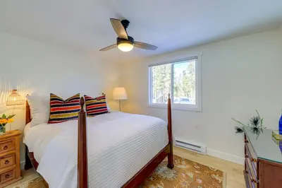 a bedroom with a bed and a ceiling fan at Spacious Black Hawk Home with Deck and Mountain Views! in Black Hawk