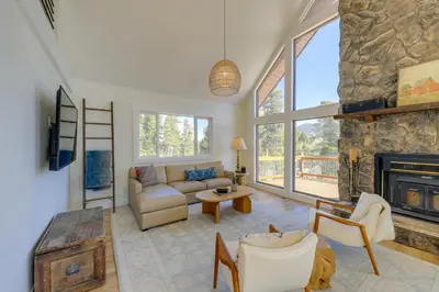 a living room with a couch and a fireplace at Spacious Black Hawk Home with Deck and Mountain Views! in Black Hawk