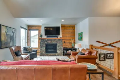 a living room with a couch and a fireplace at Family Home with Hot Tub 6 Mi to Winter Park Resort in Fraser