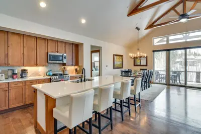 a kitchen with a large island with white counter tops at Family Home with Hot Tub 6 Mi to Winter Park Resort in Fraser