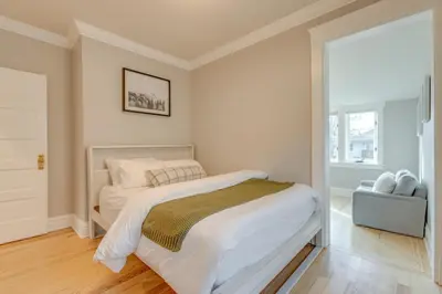 a white bedroom with a bed and a window at Hot Tub, Fire Pits Ideally Located Denver Home! in Denver