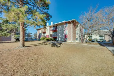 a large yard in front of a house at Cozy Westminster Condo 14 Mi to Downtown Denver! in Westminster