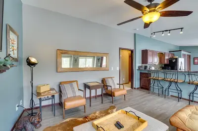 a living room with a couch and a table at 13 Mi to Winter Park Mtn-View Granby Cabin in Granby