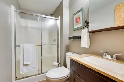 a bathroom with a shower and a toilet and a sink at 13 Mi to Winter Park Mtn-View Granby Cabin in Granby