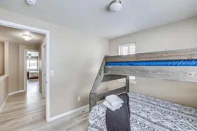 a bedroom with a bunk bed in a room at 5 Mi to Keystone Resort Mountain-View Townhome! in Dillon