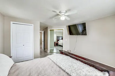 a bedroom with a ceiling fan and a bed with a rug at 5 Mi to Keystone Resort Mountain-View Townhome! in Dillon