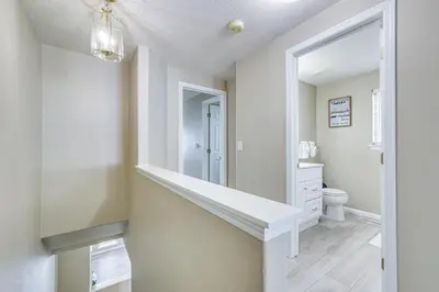 a white bathroom with a sink and a toilet at 5 Mi to Keystone Resort Mountain-View Townhome! in Dillon