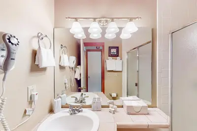 a bathroom with a sink and a mirror at Lake to Mountain in Keystone