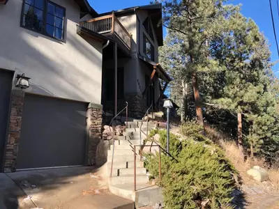 a house with stairs leading up to a building at Morrison Colorado Mountain Getaway - Red Rocks in Morrison