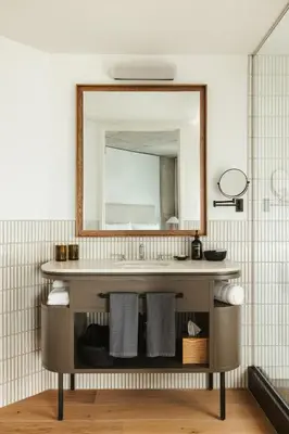 a bathroom with a sink and a mirror at Populus in Denver