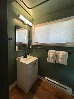 a bathroom with a sink and a mirror at Riverside Colorado in Bellvue