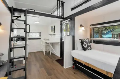 a bedroom with a bunk bed and a desk at Riverside Colorado in Bellvue