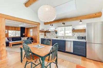 a kitchen and living room with a table and chairs at 3 Mi to Rocky Mtn Natl Park Grand Lake Cabin in Grand Lake