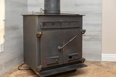 an old metal stove sitting in a room at Downtown Denver: 4bd - Game/Movie Room - Backyard in Arvada