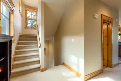 a staircase in a house with a window at 6554 Settlers Creek townhouse in Keystone