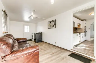 a living room with a brown leather couch at Covered Patio, Gas Grill and Yard Sheridan Home! in Sheridan