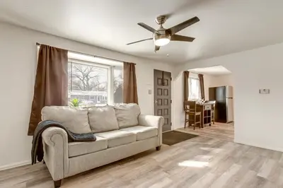 a living room with a couch and a ceiling fan at Covered Patio, Gas Grill and Yard Sheridan Home! in Sheridan