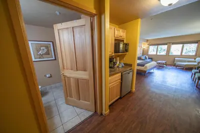 a room with a door open to a living room at Gateway Lodge 5027 by SummitCove Lodging in Keystone