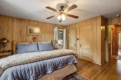 a bedroom with a bed and a ceiling fan at Hidden Pines -- EV#3034 home in Estes Park