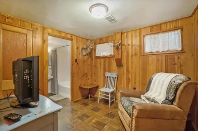 a living room with a couch and a tv at Hidden Pines -- EV#3034 home in Estes Park