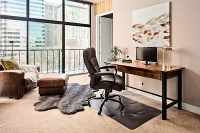 an office with a desk with a computer and a chair at Larimer Square Luxury - Office - Downtown Hub in Denver