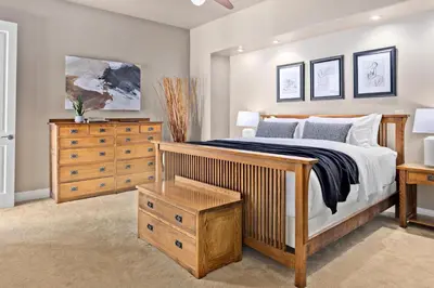 a bedroom with a bed and a wooden dresser at Larimer Square Luxury - Office - Downtown Hub in Denver