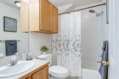 a bathroom with a sink and a toilet and a shower at 12 Mi to DIA Cozy Denver Townhome with Fireplace! in Aurora