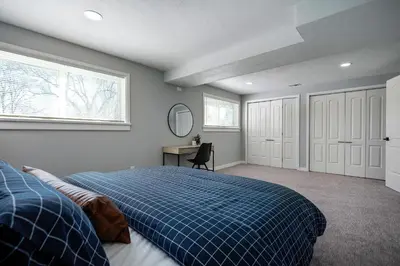 a bedroom with a bed and a desk and a window at Serene 4-Bedroom Getaway in Arvada! Pet-friendly! in Arvada