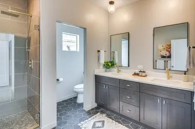 a bathroom with two sinks and a shower at Granby Retreat with Community Pool Ski-InandSki-Out! in Granby