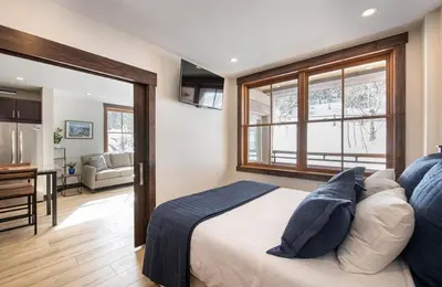 a bedroom with a bed and a desk in a room at Premium Unit 1301 - 1 Bedroom - Zephyr Mtn Lodge condo in Winter Park