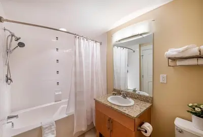 a bathroom with a sink and a tub and a shower at Select Unit 3606 - Fraser Crossing Founders Pointe condo in Winter Park