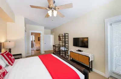 a bedroom with a bed and a ceiling fan at Select Unit 3606 - Fraser Crossing Founders Pointe condo in Winter Park