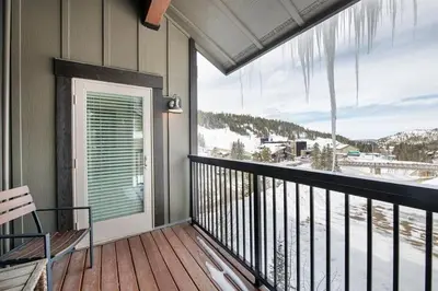 a balcony with a view of a snow covered mountain at Select Unit 3606 - Fraser Crossing Founders Pointe condo in Winter Park