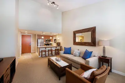 a living room with a couch and a table at Select Unit 3606 - Fraser Crossing Founders Pointe condo in Winter Park