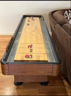 a wooden snooker game table on a couch at Mountain Top Luxury Red Rocks Hot tub Sauna Views in Golden