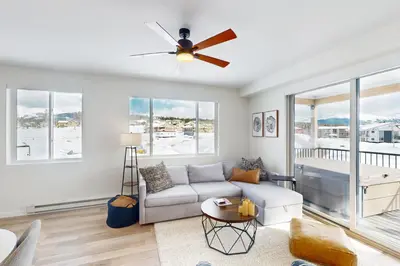 a living room with a couch and a ceiling fan at Sunnyside Up in Fraser