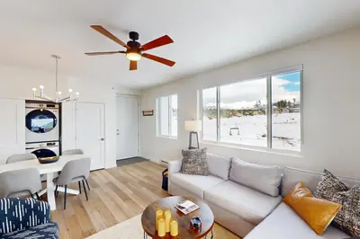a living room with a couch and a table at Sunnyside Up in Fraser