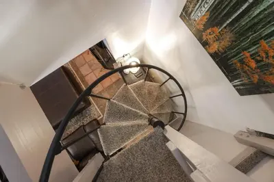 an overhead view of a spiral staircase in a house at Wild Irishman Off-Piste Condo: Great Keystone Getaway in Keystone