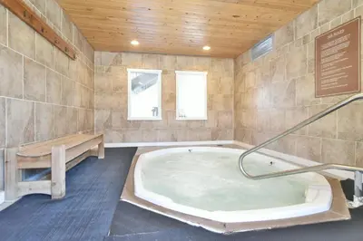 a large bathroom with a tub in a room at Wild Irishman Off-Piste Condo: Great Keystone Getaway in Keystone