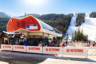 a crowd of people at a ski lift at a ski slope at Wild Irishman Off-Piste Condo: Great Keystone Getaway in Keystone