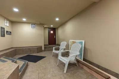 a room with two white chairs and a table at Lodge at Lake Dillon Condo: Great Year-Round Location in Dillon