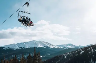 a group of people riding on a ski lift at Frisco Mountainside Retreat: Walk Downtown in Frisco